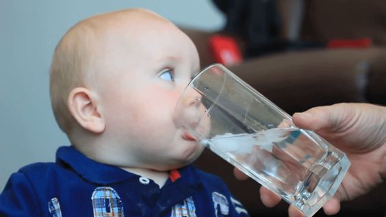 A baby is drinking water A baby is drinking water