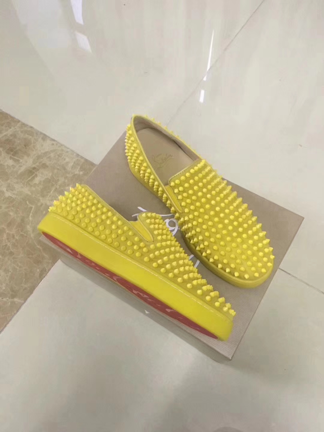 yellow spiked loafers
