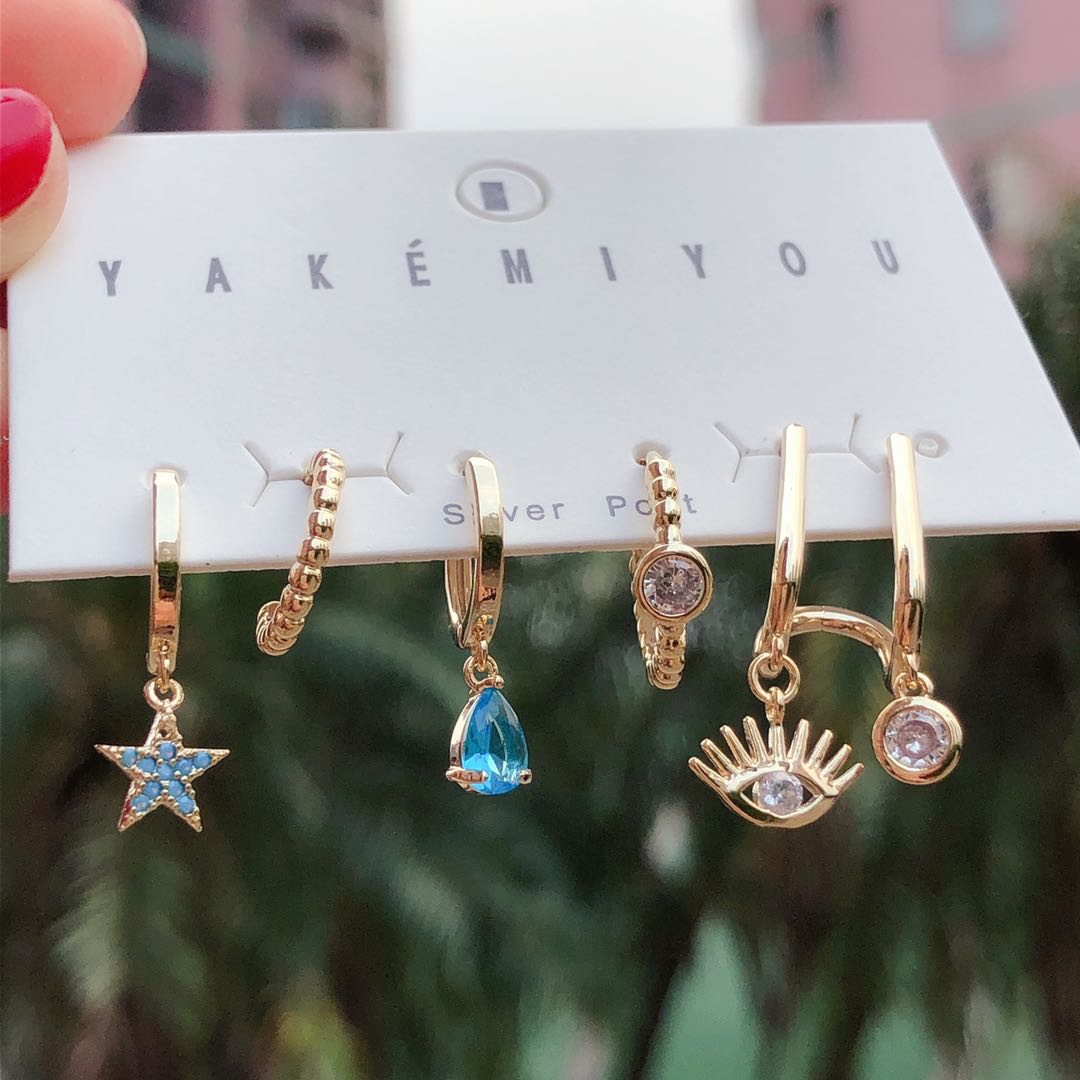 Set star charm , eye charm earring
