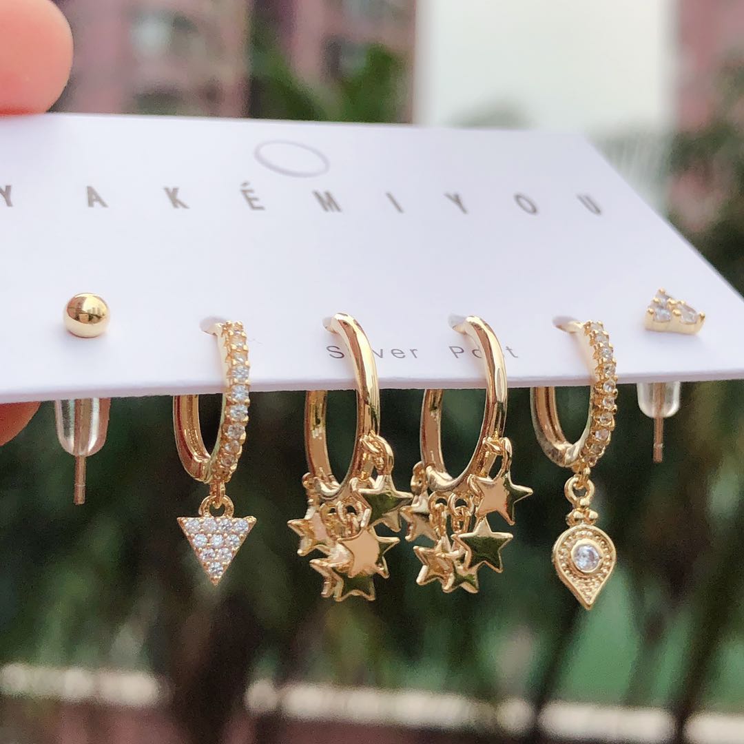 Mini star charm earring