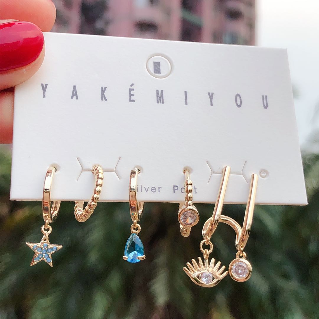 Set star charm , eye charm earring