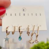 Set star charm , eye charm earring
