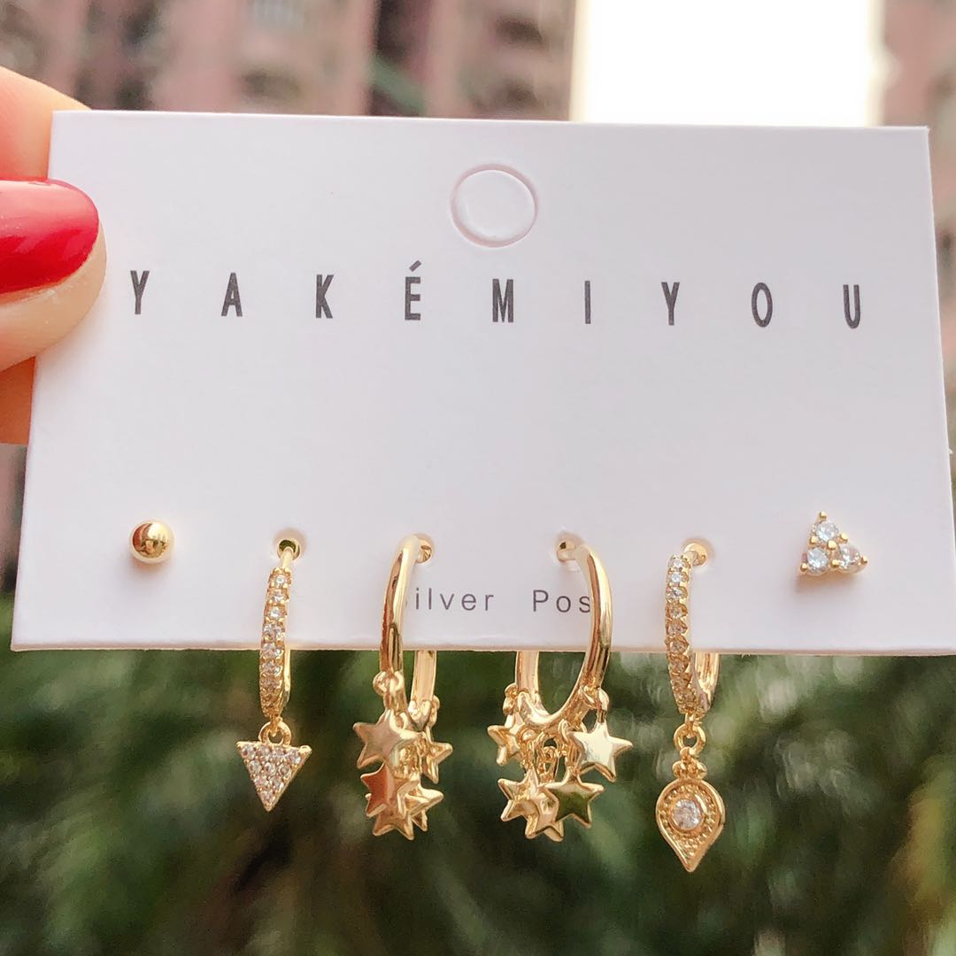 Mini star charm earring
