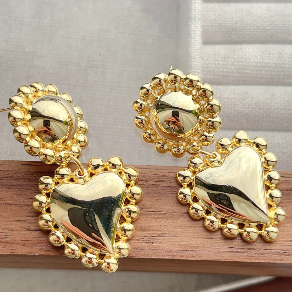 Gold heart drop earring