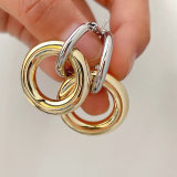 Silver round hoop earring with gold round pendant