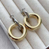 Silver round hoop earring with gold round pendant