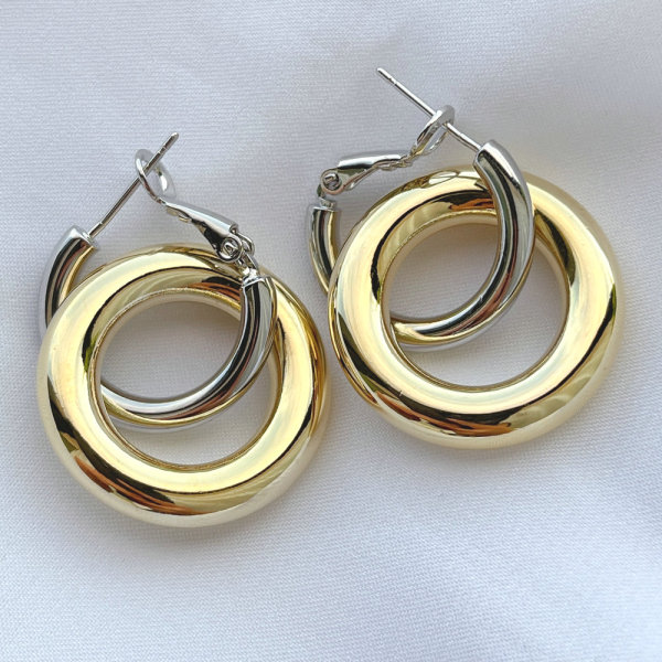 Silver round hoop earring with gold round pendant