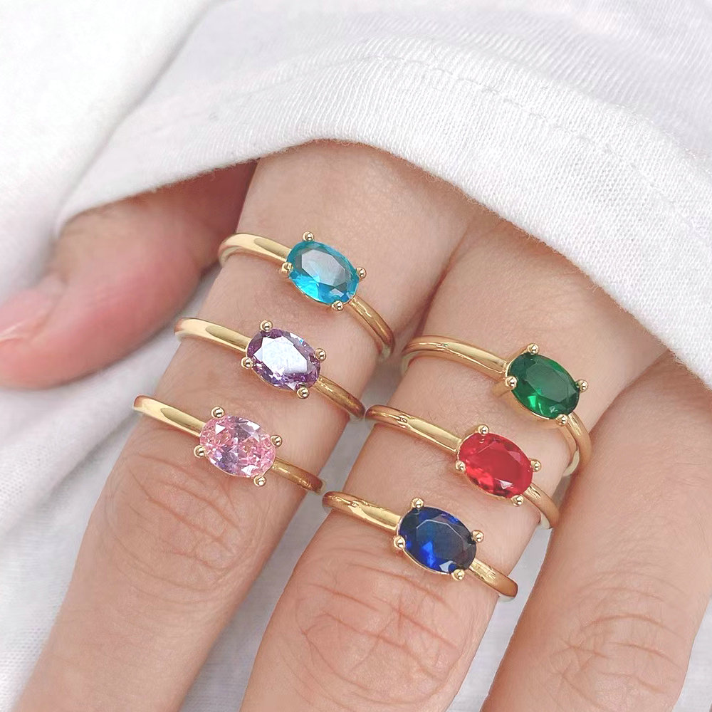 Egg shaped colored stone adjustable ring
