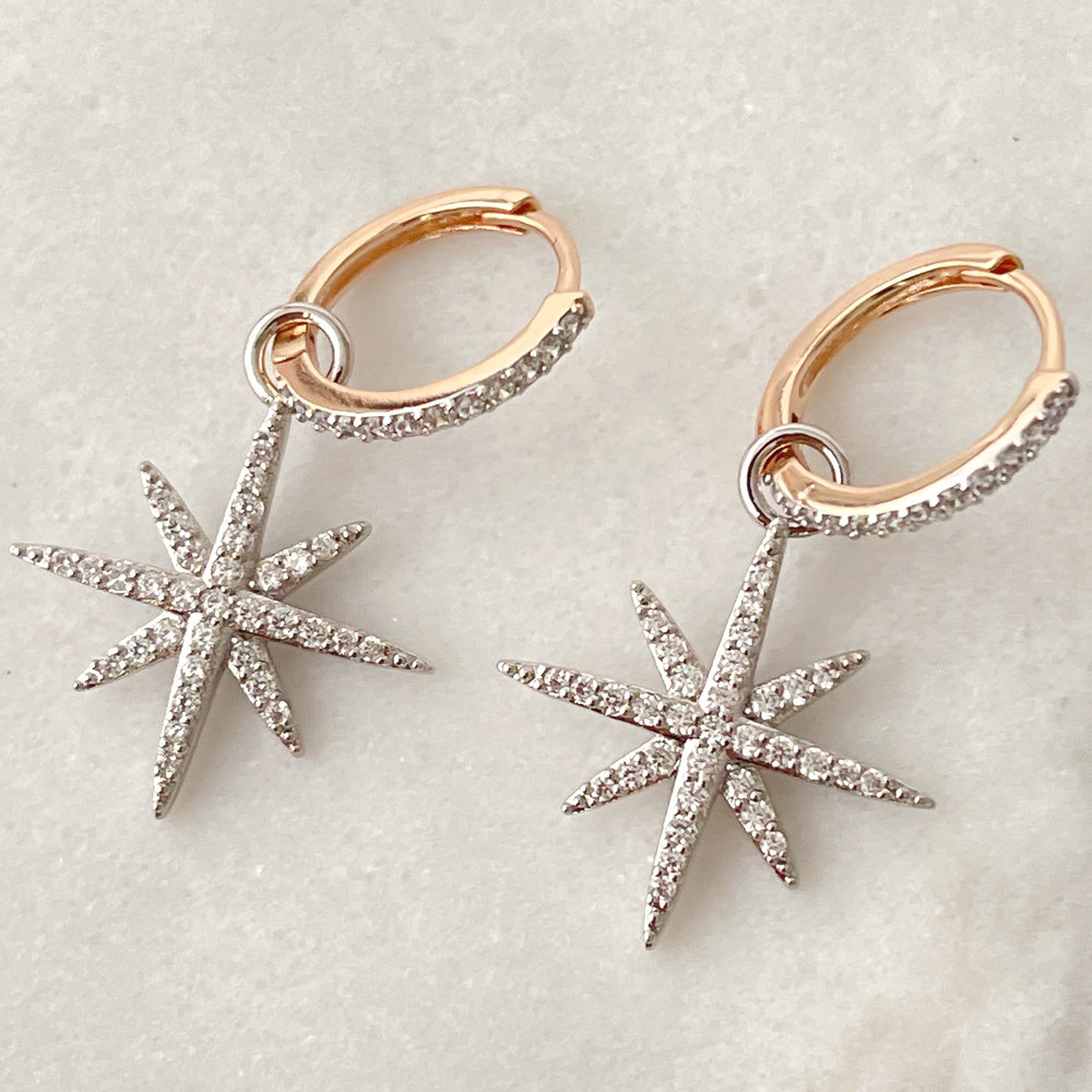 Gold hoop earring with silver star charm