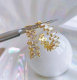 Pave zircon C hoop earring