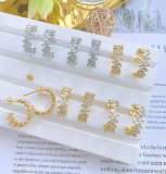 Pave zircon C hoop earring