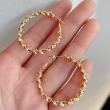 Twist hoop earring