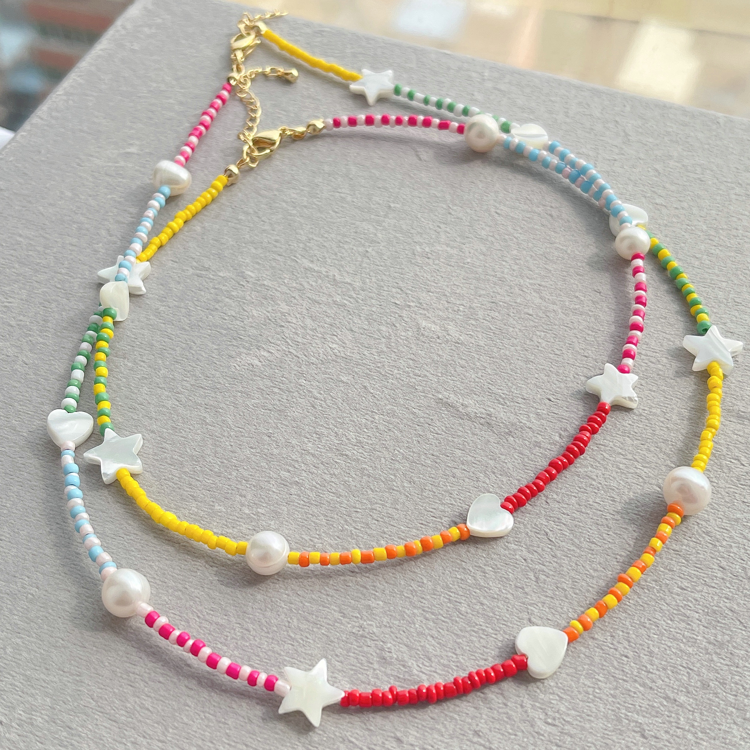 Colorful beaded necklace with shell star and heart