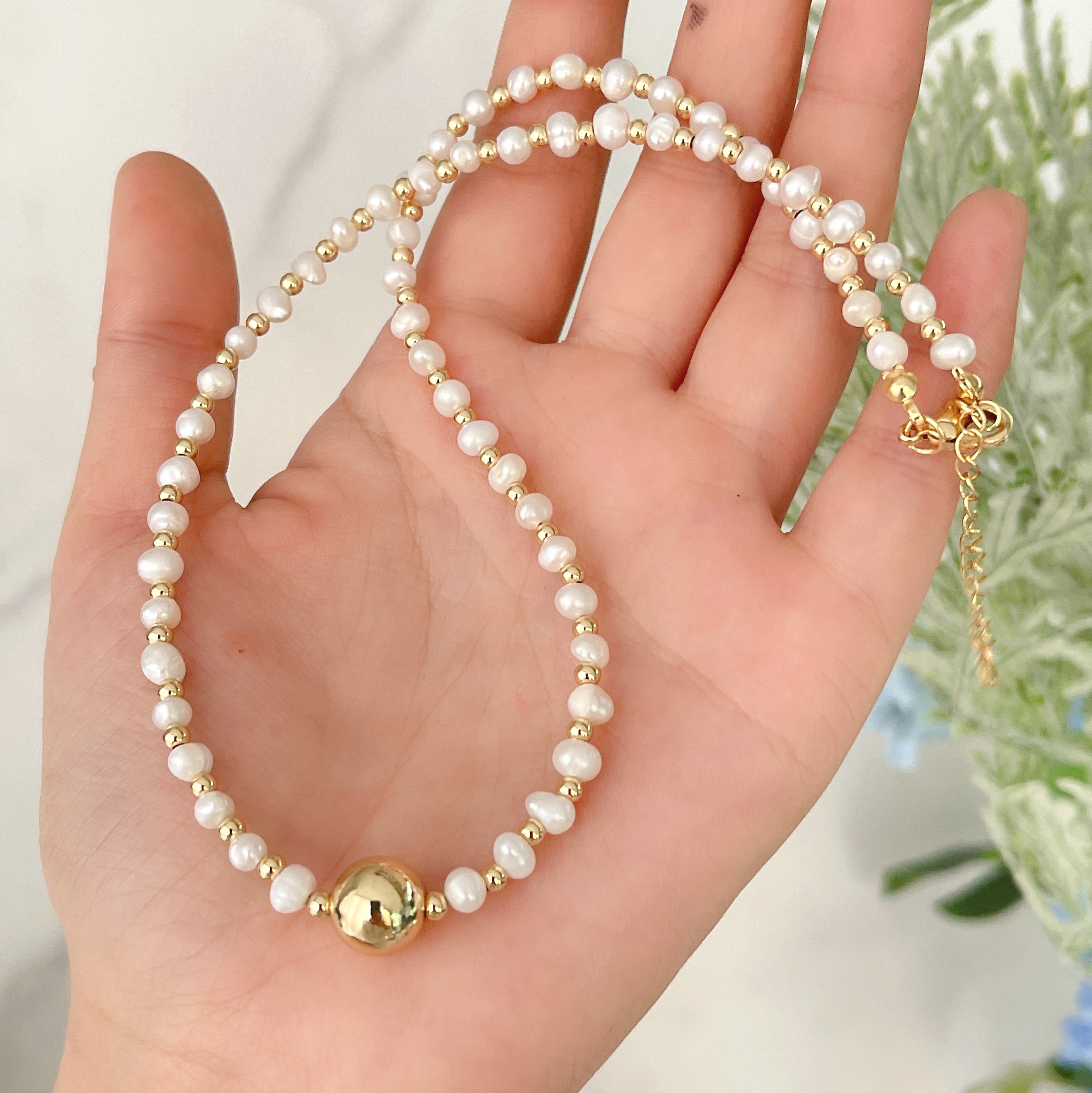 Fresh water pearl necklace with gold beads