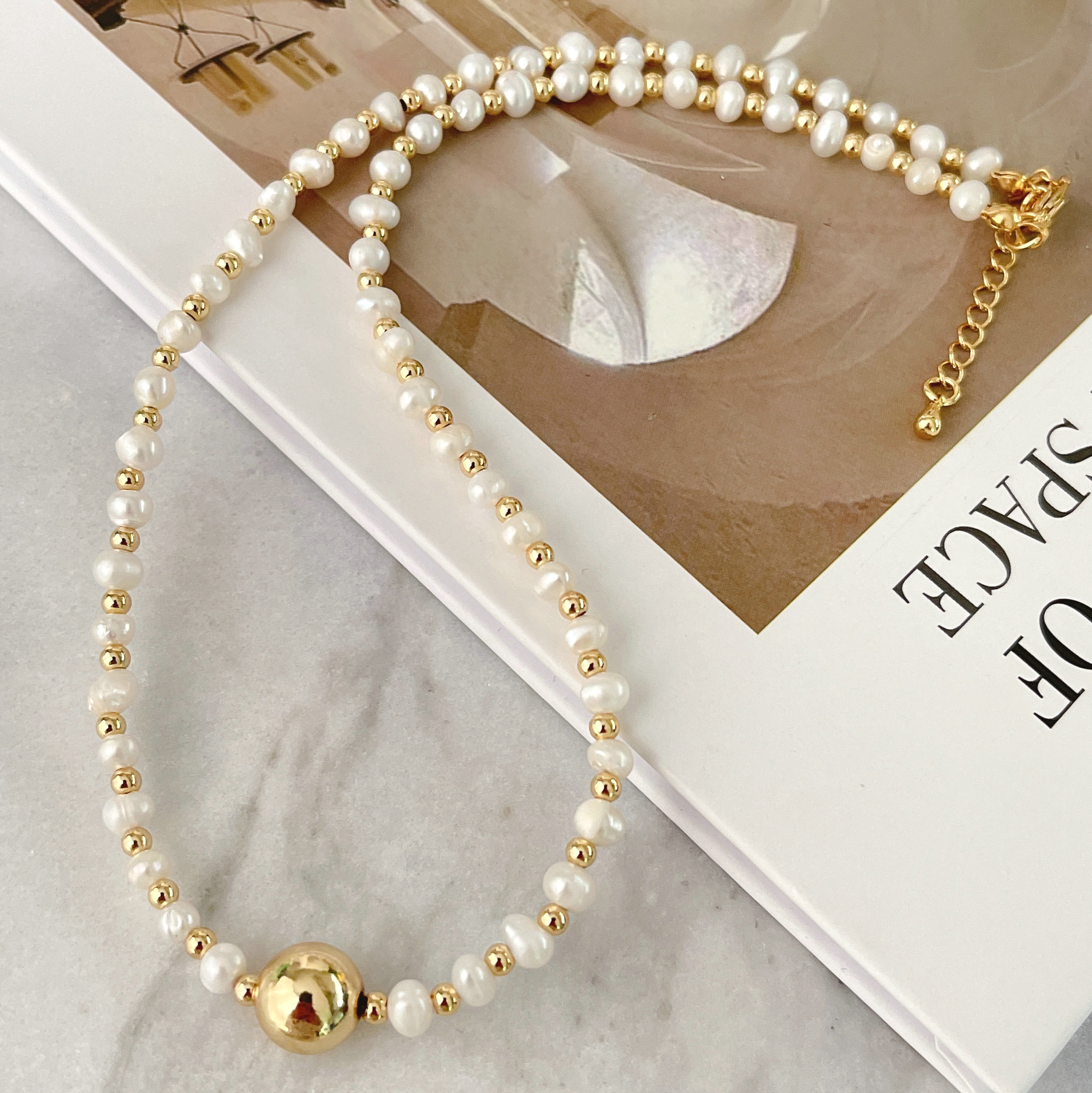 Fresh water pearl necklace with gold beads