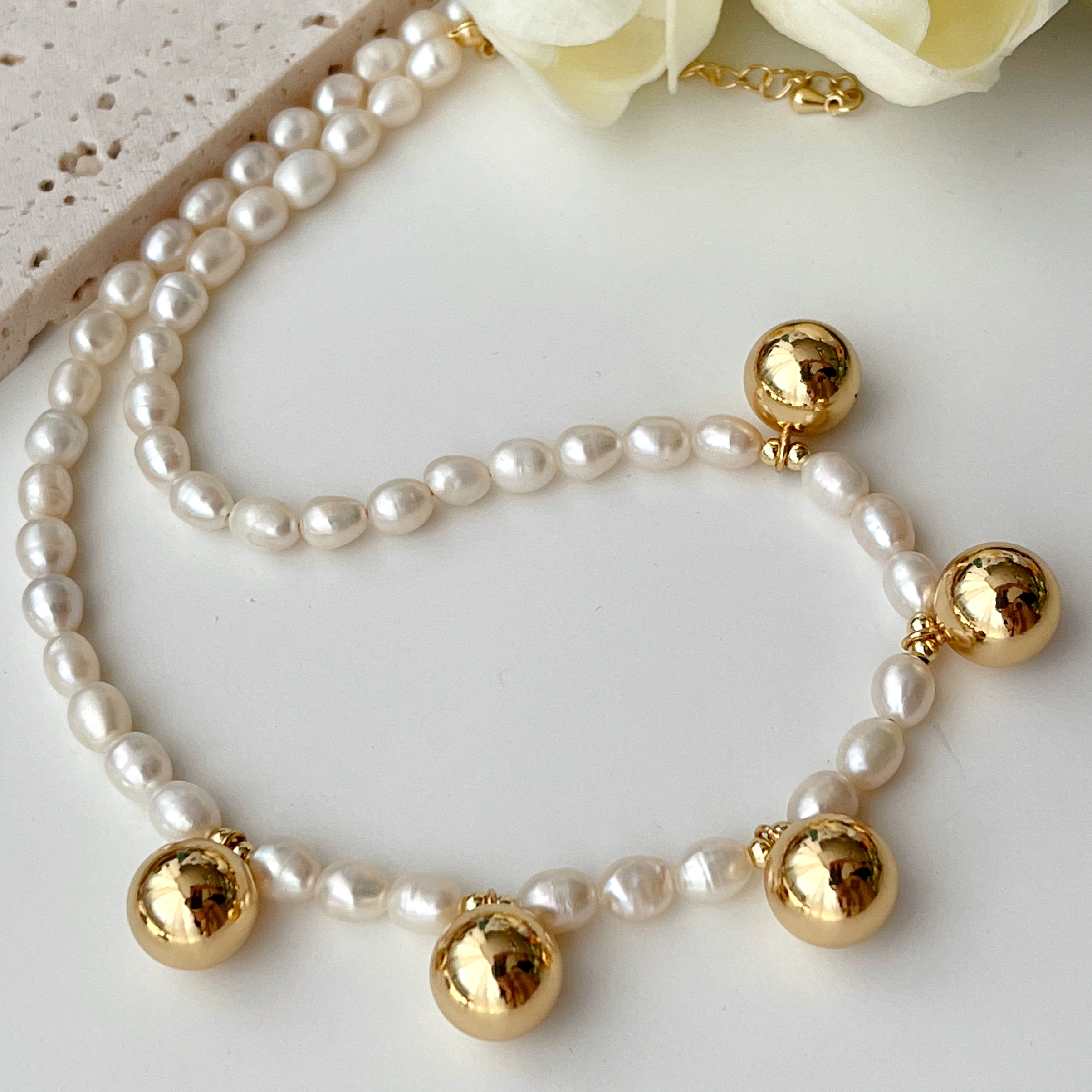 Long Pearl Necklace with Gold Ball Charm