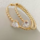 Gold Beaded Heart Hoop Earrings