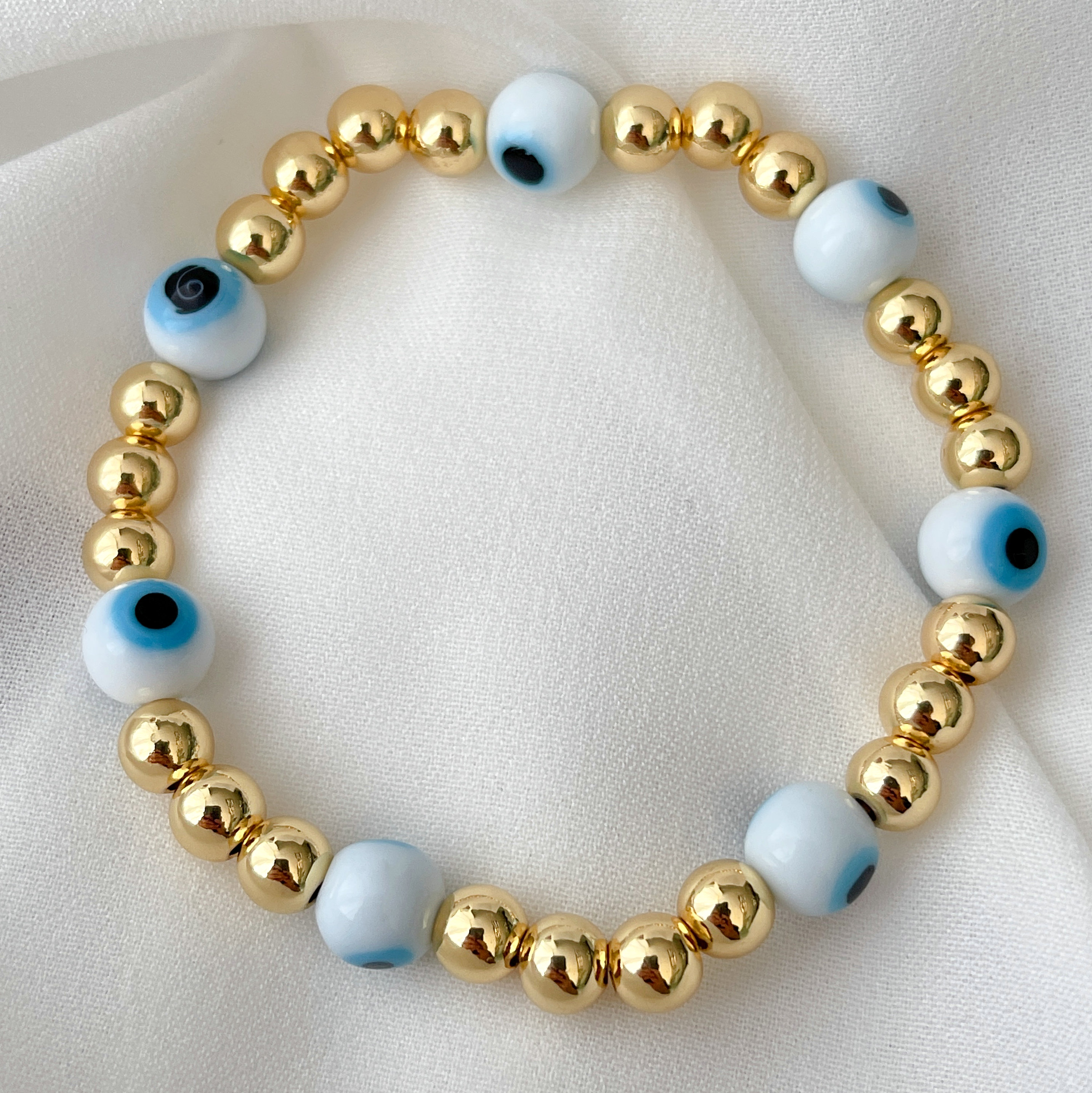 6mm Gold Beaded Elastic Bracelet With White Evil Eye Beaded