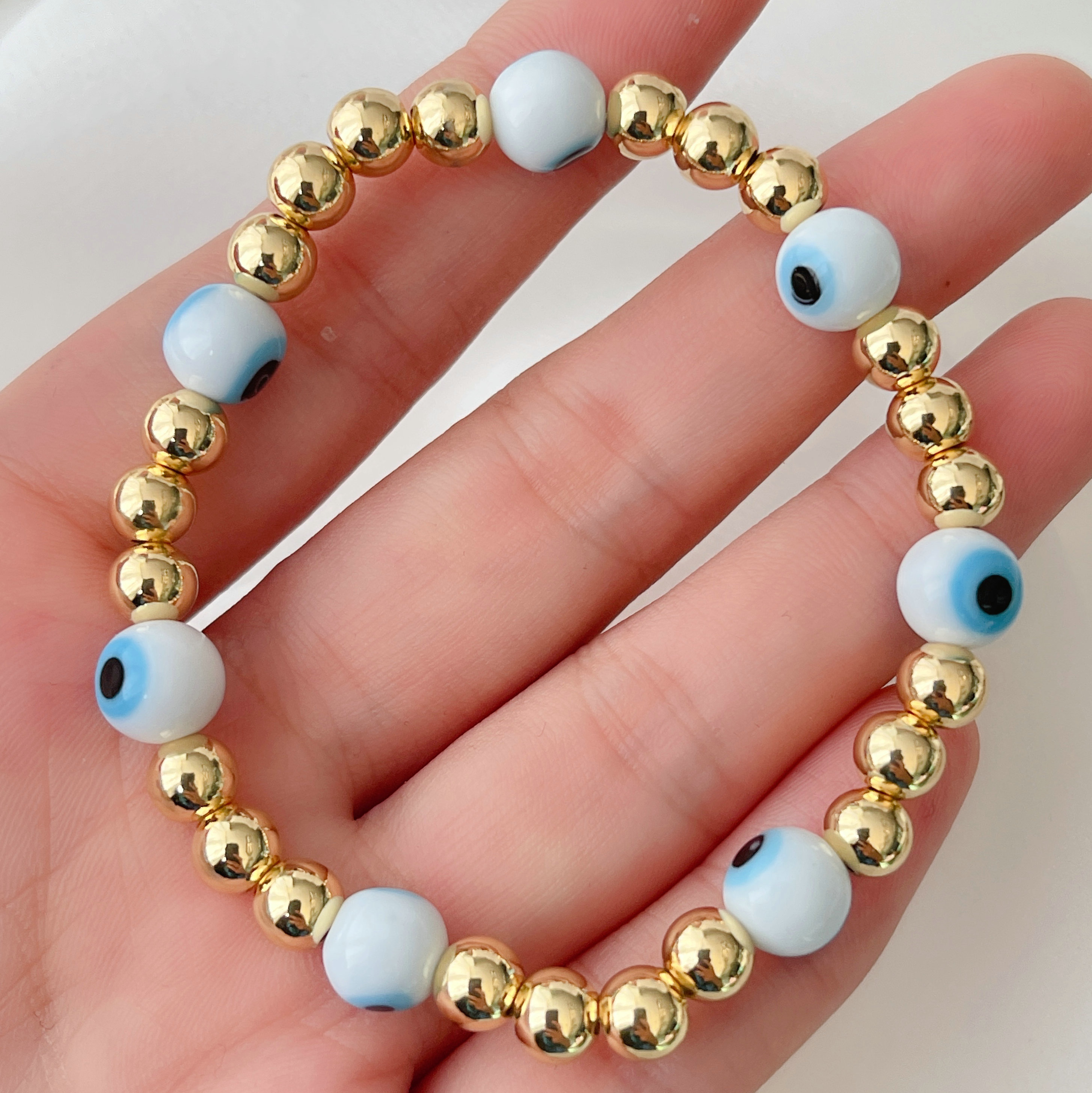 6mm Gold Beaded Elastic Bracelet With White Evil Eye Beaded