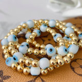 6mm Gold Beaded Elastic Bracelet With White Evil Eye Beaded