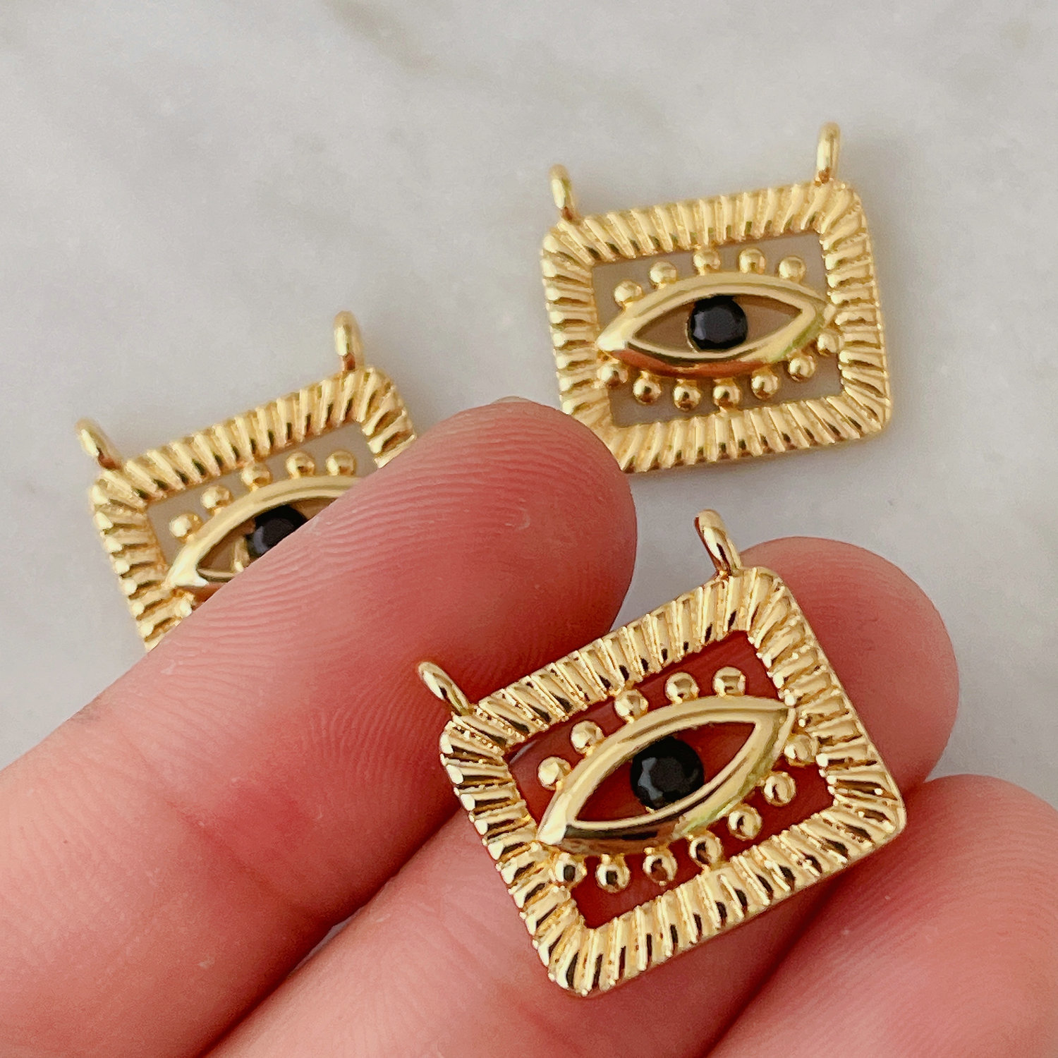Square eye charm