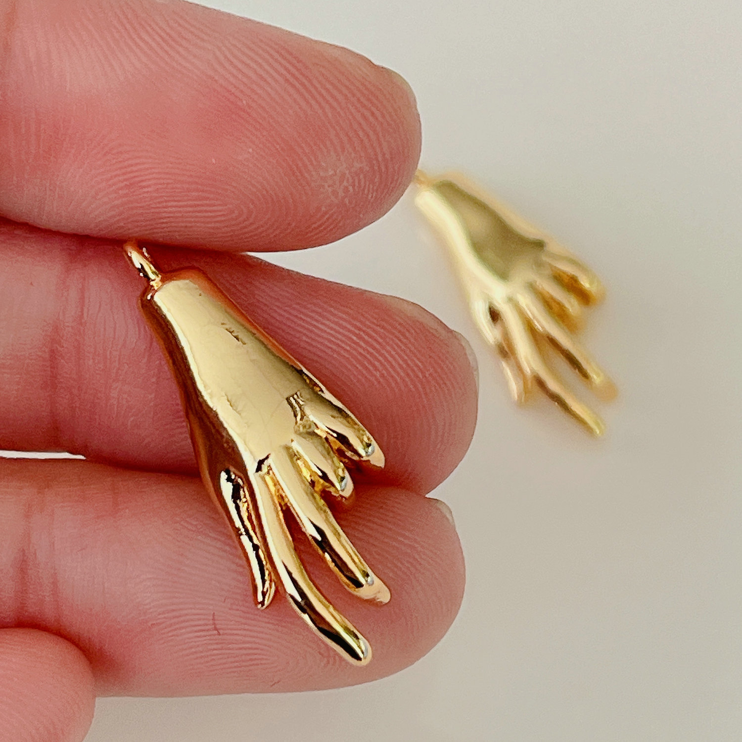 Hand charm