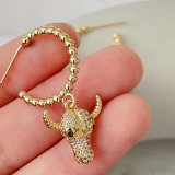 Gold beaded hoop earring with Horn charm