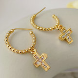 Gold bead hoop earring with cross charm