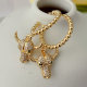 Gold beaded hoop earring with Horn charm