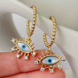 Gold beaded hoop earrings with eye charm