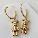 Gold bead hoop earring with teddy charm