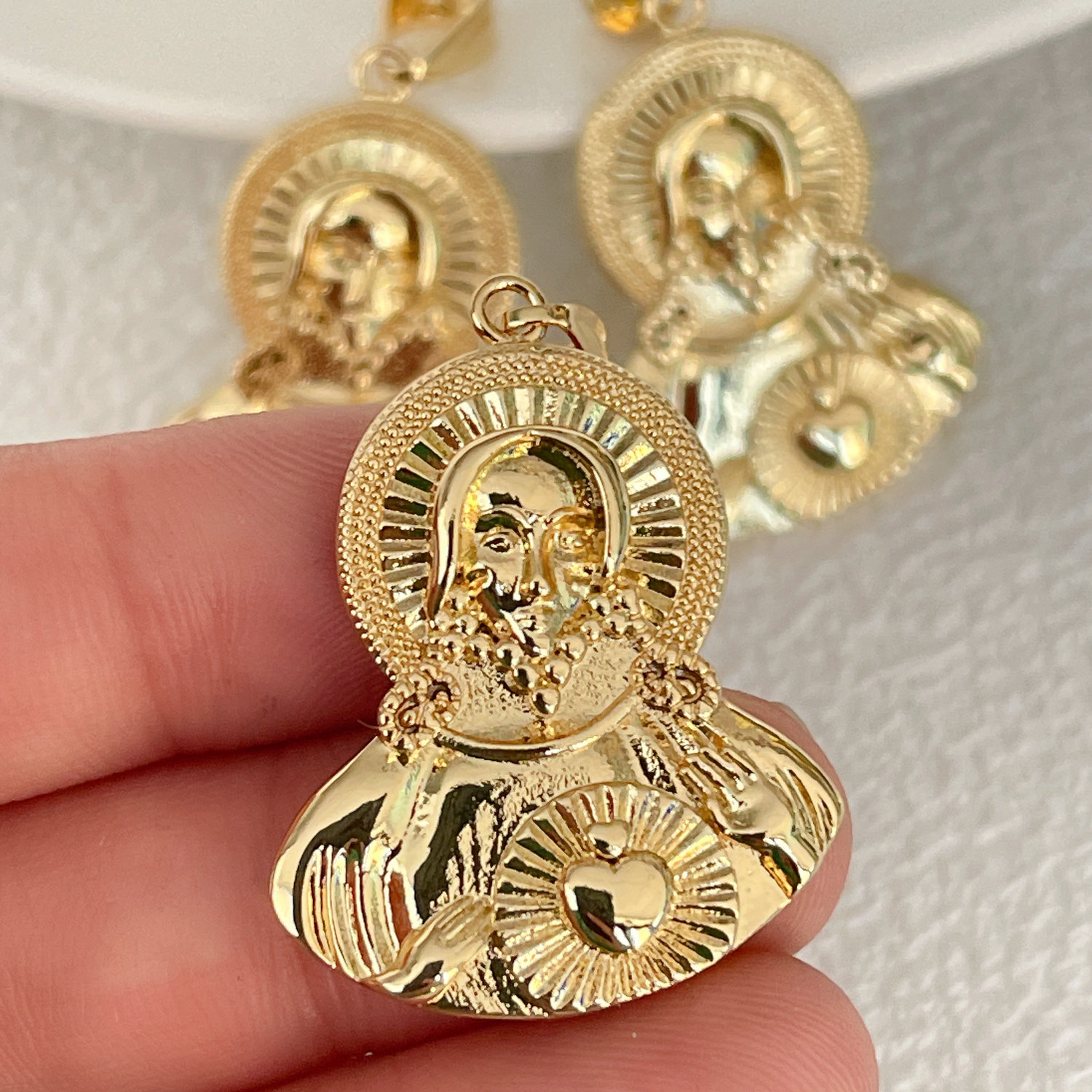 metal religious charm