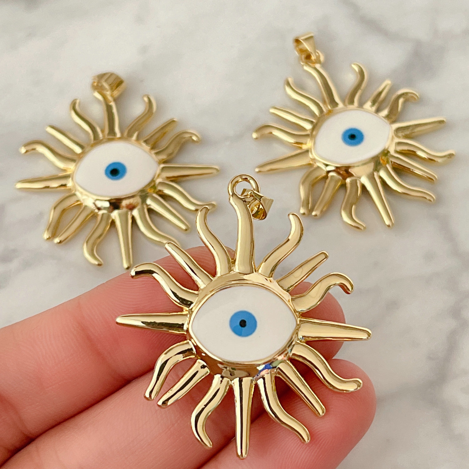 White enamel eye charm