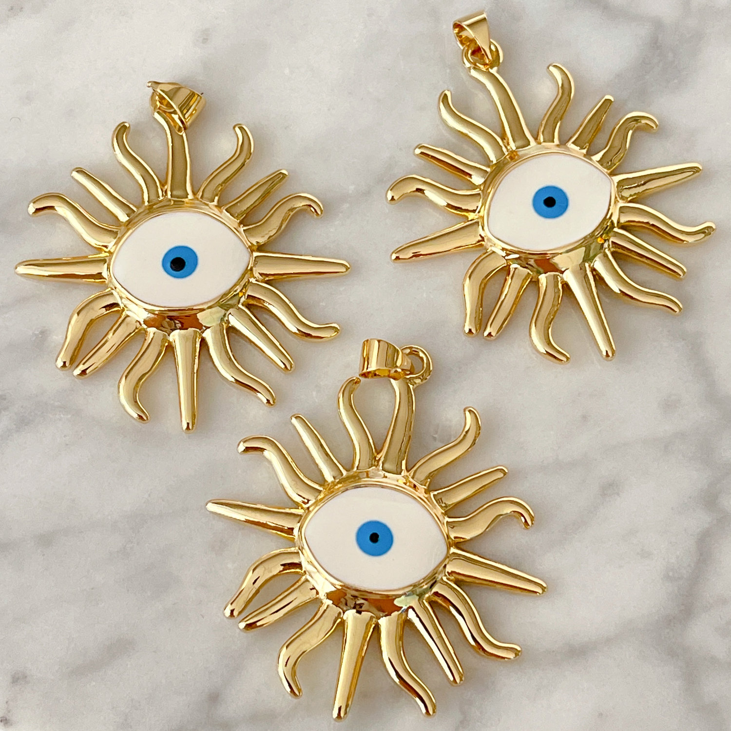 White enamel eye charm