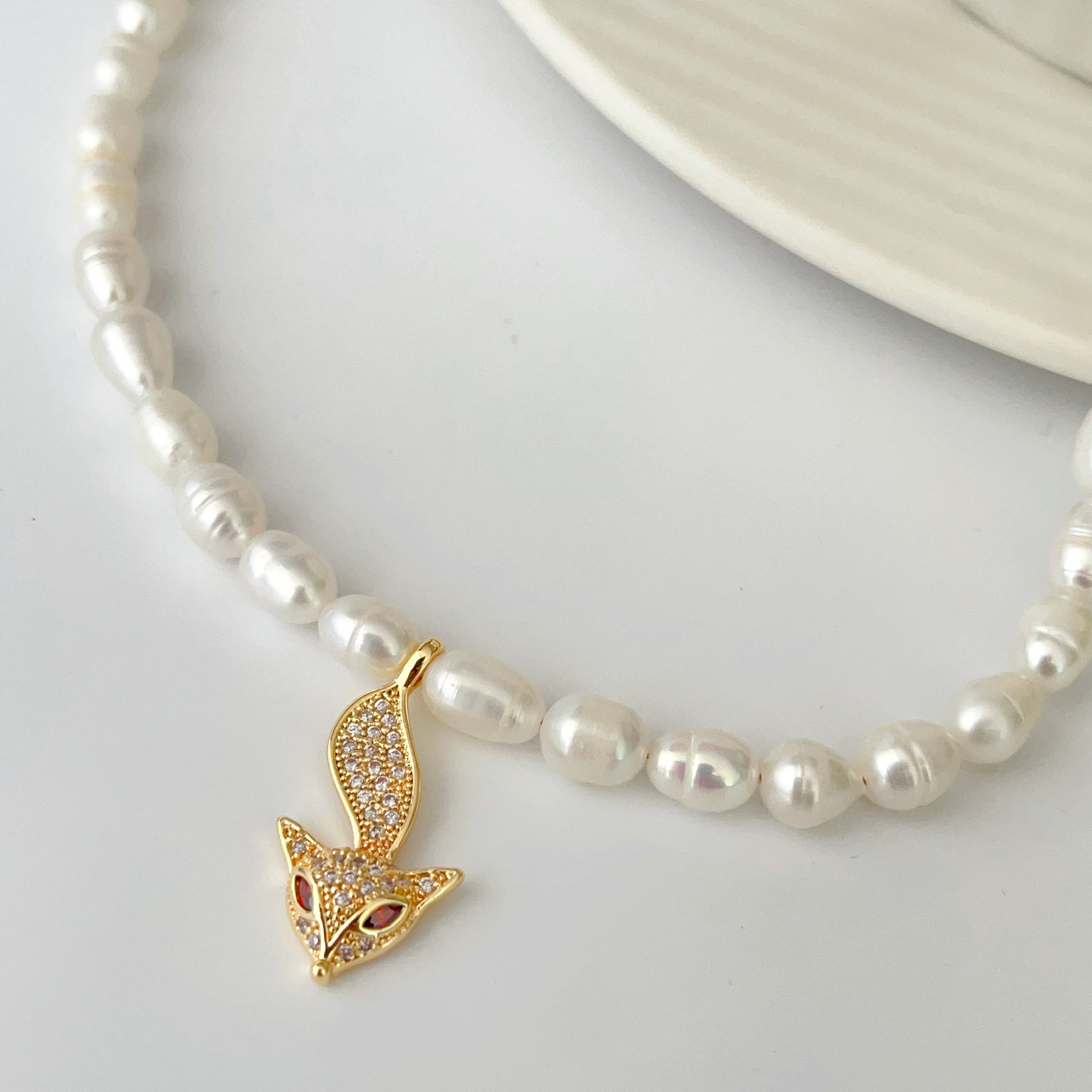 Fresh water pearl necklace with nursing pendant
