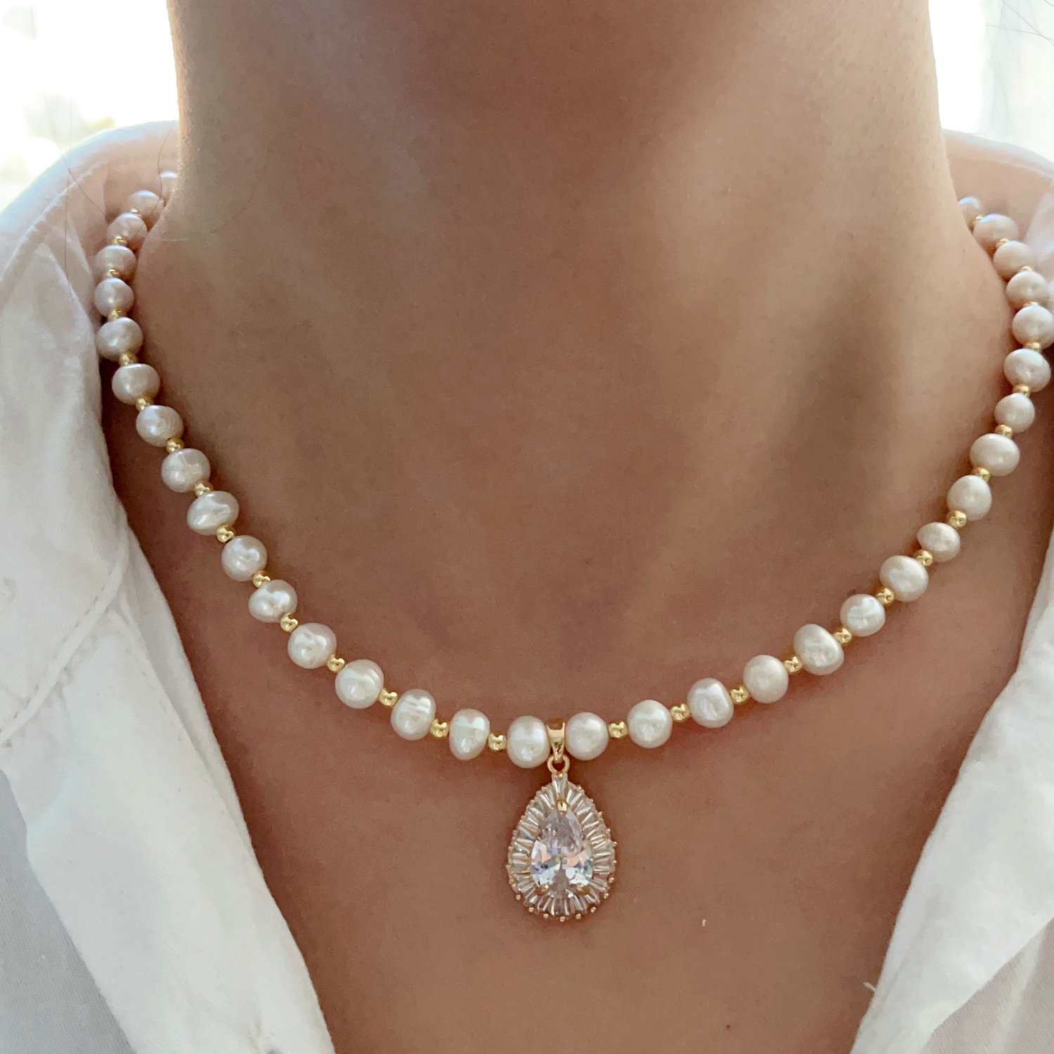 Fresh water pearl necklace with oval drop pendant