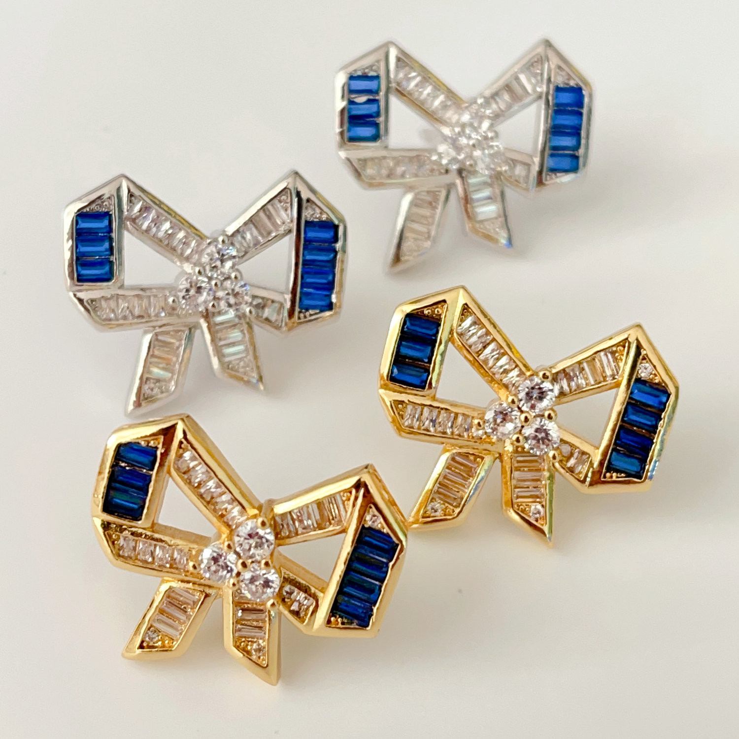 Pave blue bow earrings