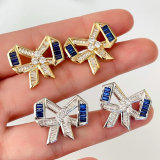 Pave blue bow earrings