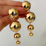 Long gold ball earrings