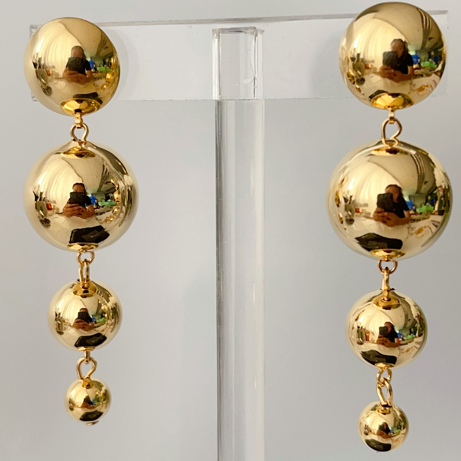 Long gold ball earrings
