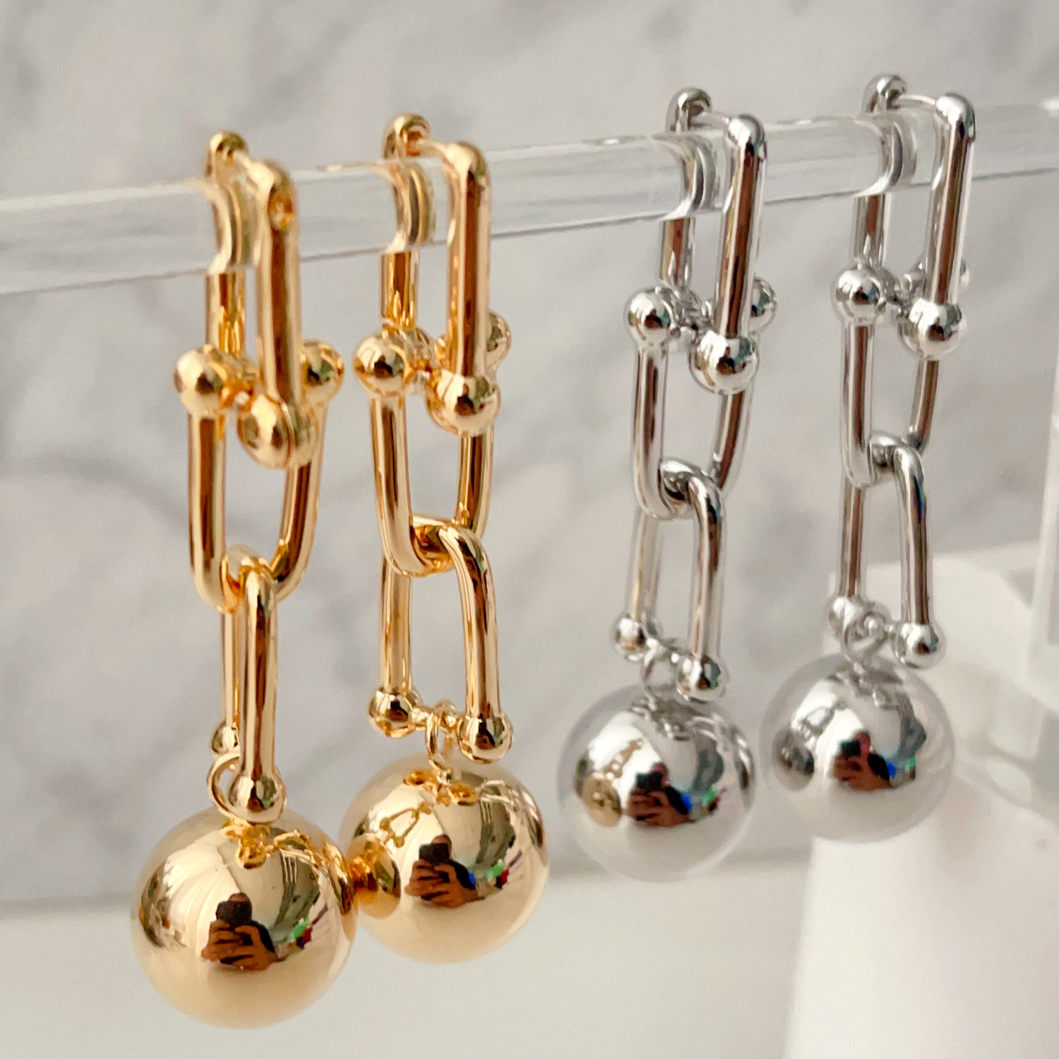 Chain earrings with gold ball pendant
