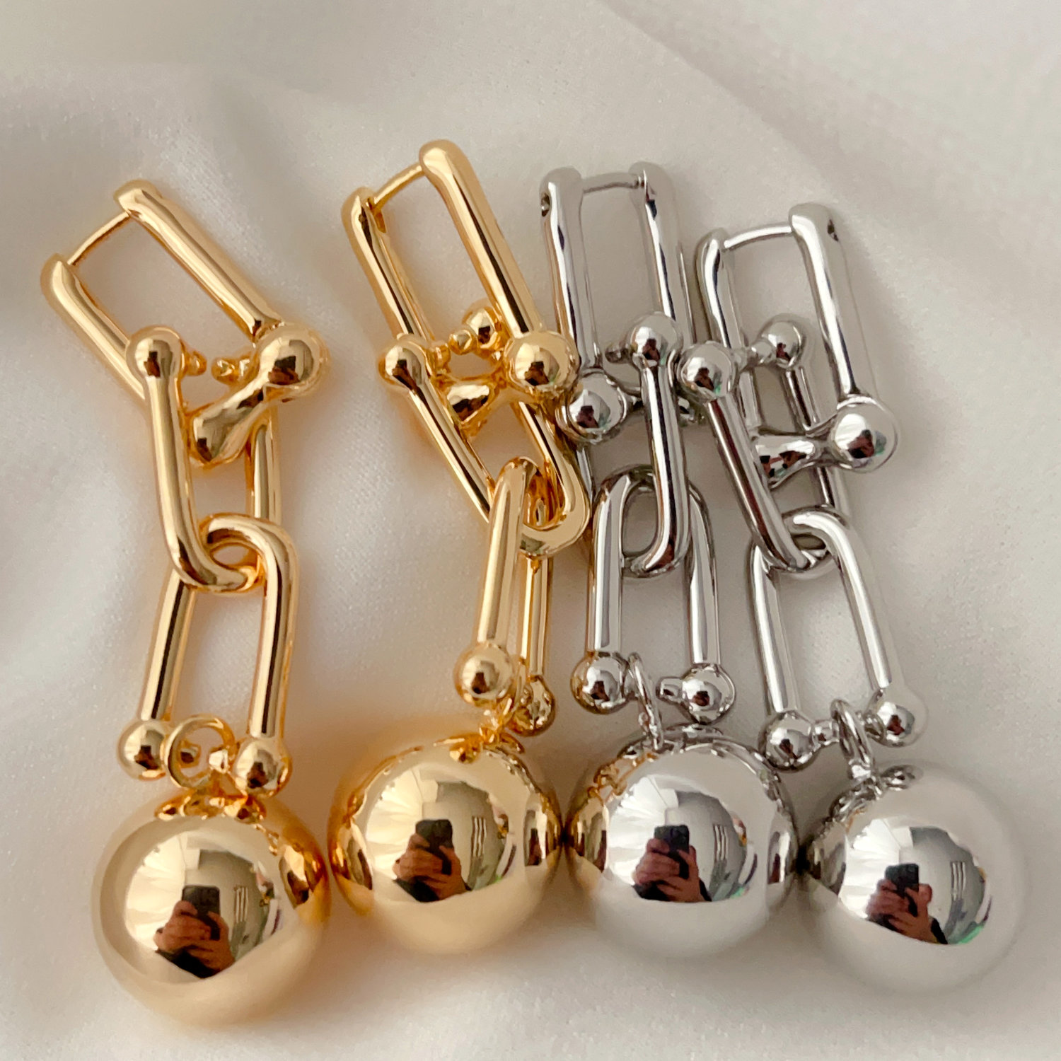 Chain earrings with gold ball pendant