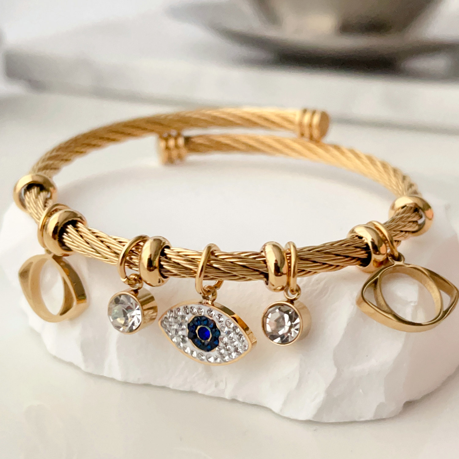 stainless steel twist bracelet with eye charm