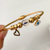 stainless steel bracelet with evil eye charm