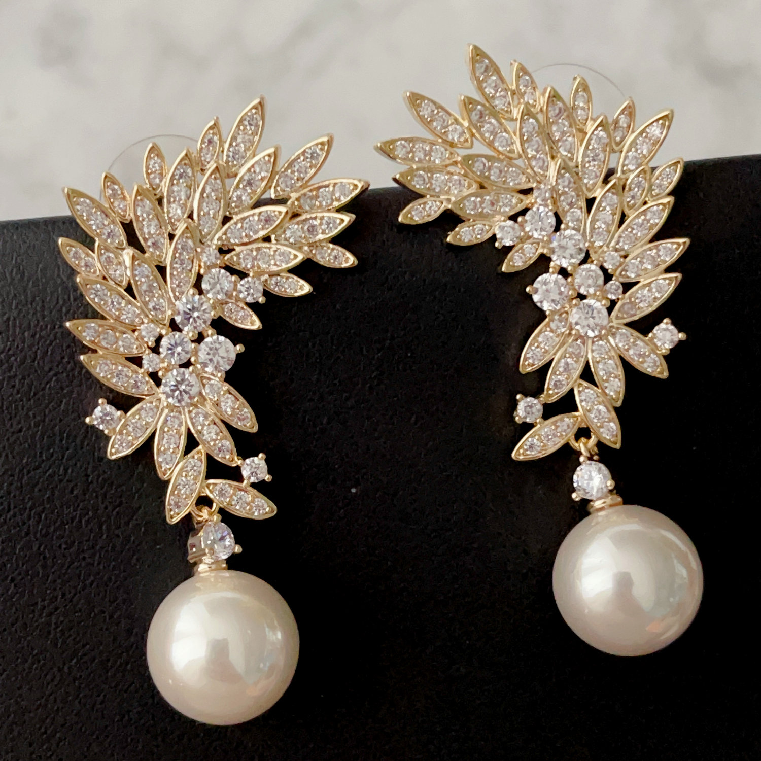 Pave leaf pearl earrings
