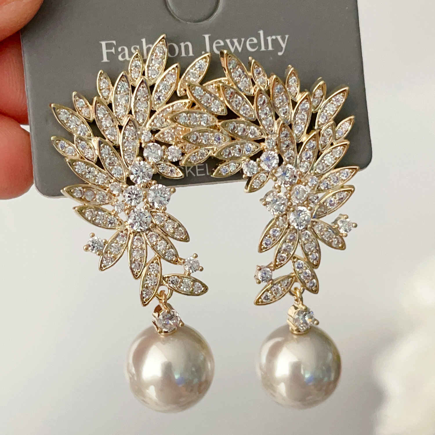 Pave leaf pearl earrings