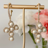 Pearl cross pendant earrings