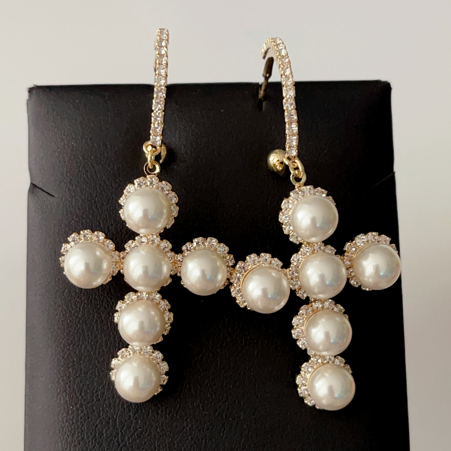Pearl cross pendant earrings