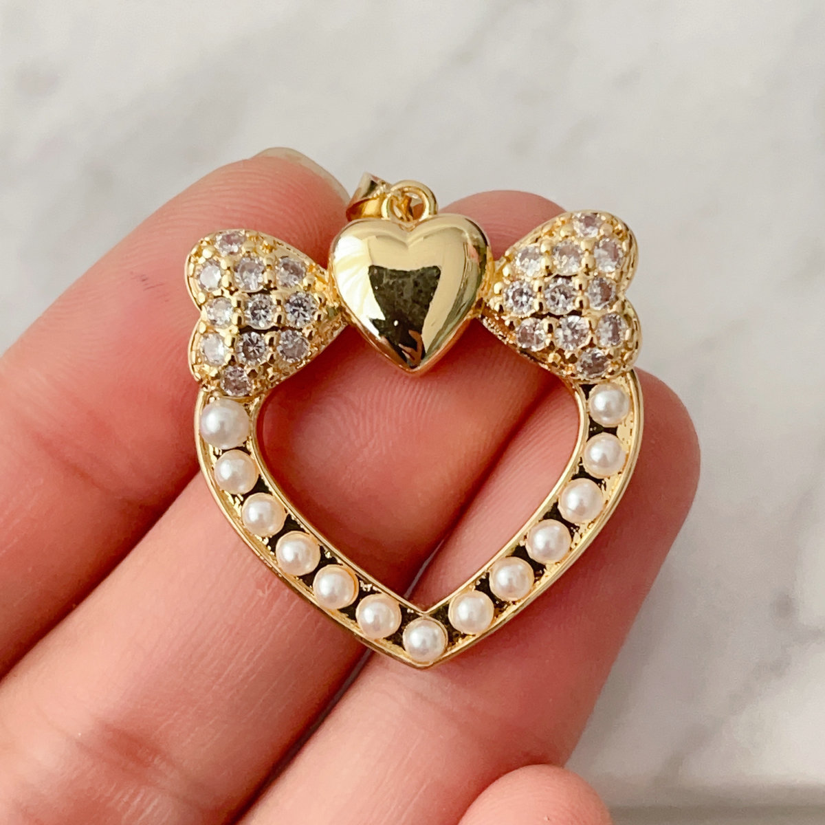 Pearl bow heart charm