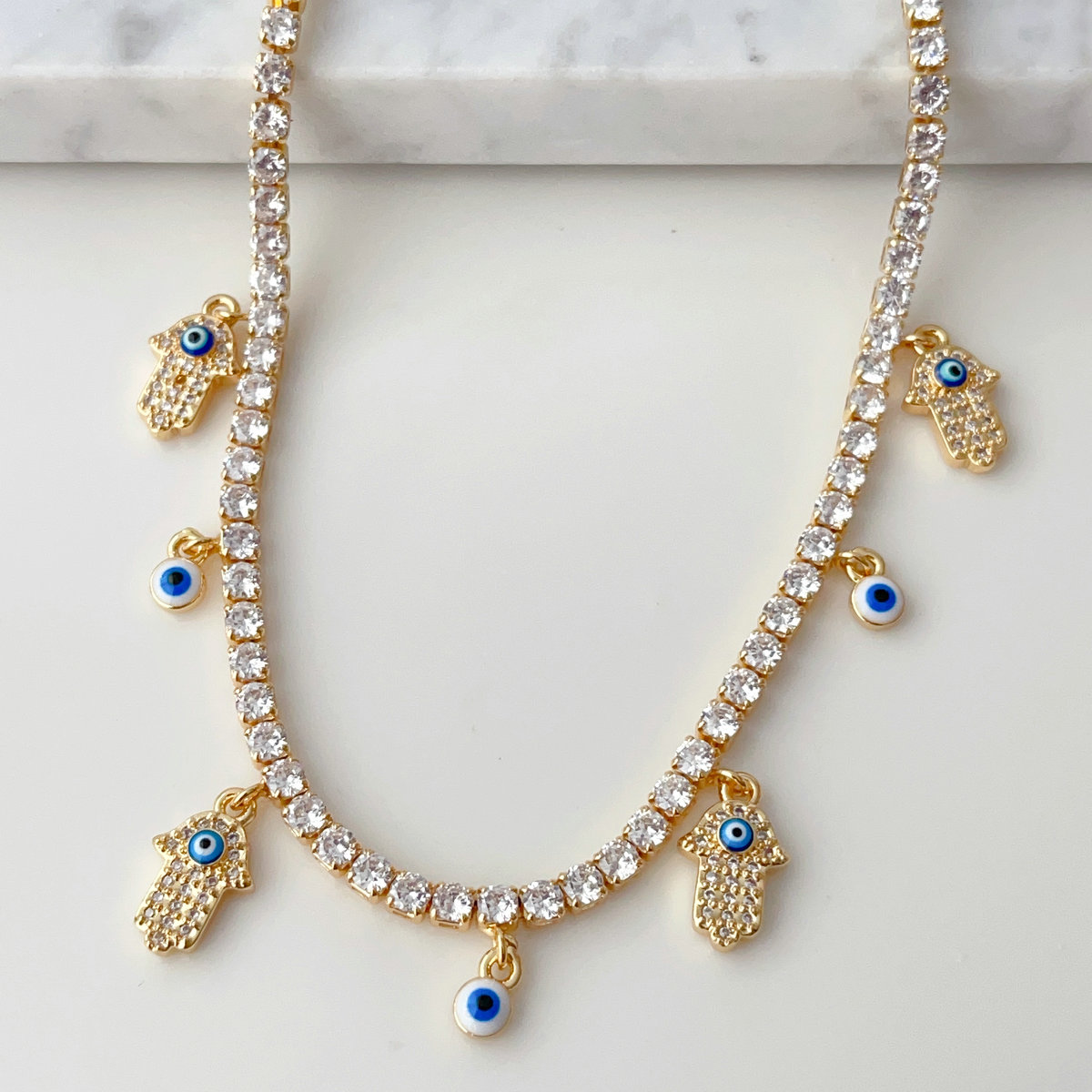 CZ tennis choker with Evil eye Hamsa charm